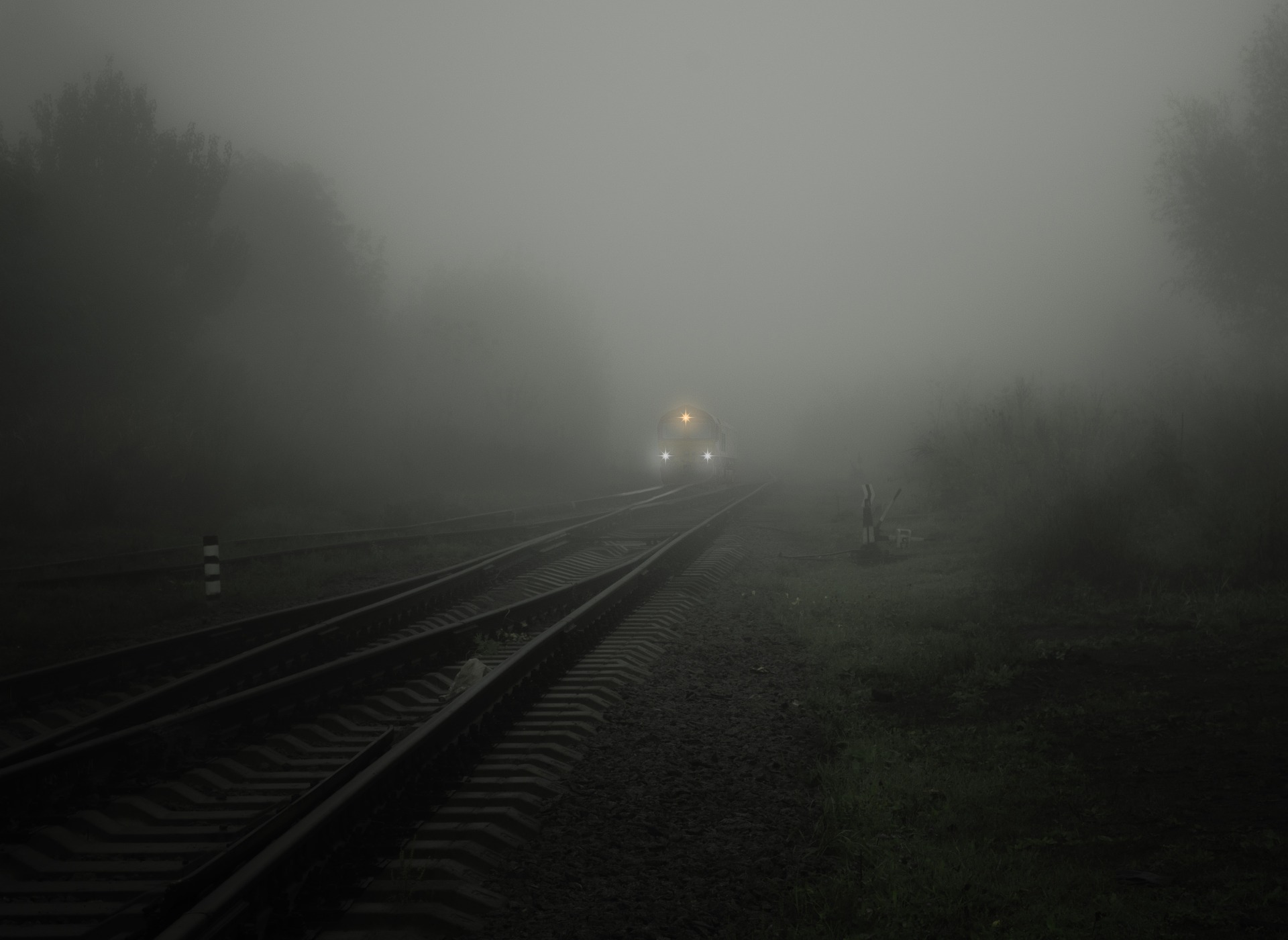 smog on tracks with train approaching